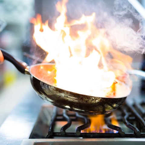 A flambé in a professional kitchen