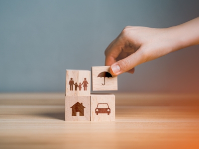 Building blocks with people, a house, a car, and an umbrella